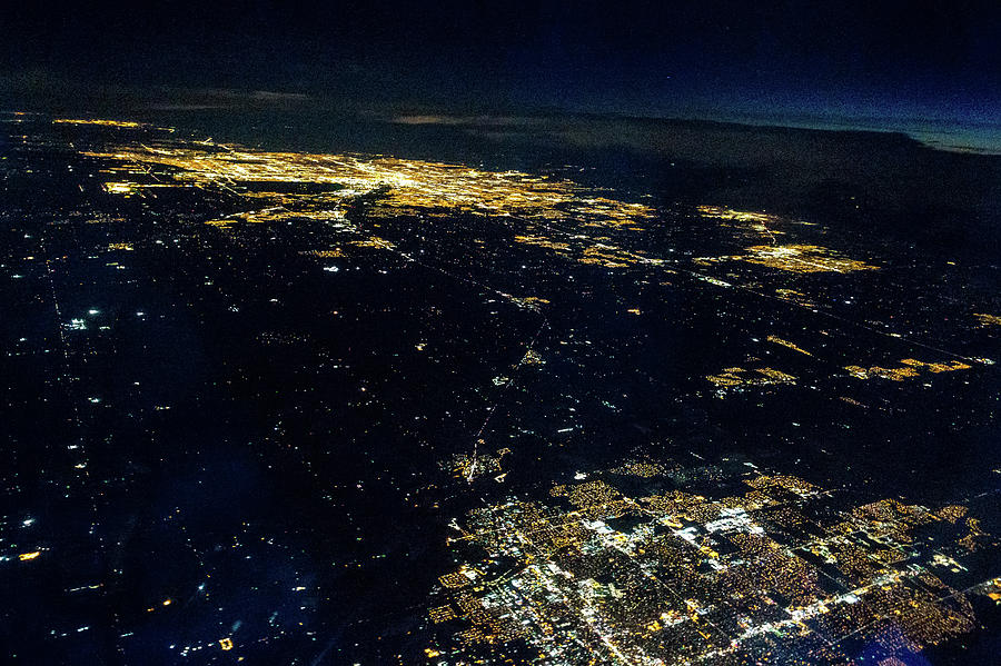 Flying at night over cities below #8 Photograph by Alex Grichenko