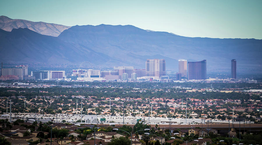 Las vegas city surrounded by red rock mountains and valley of fi #8 Photograph by Alex Grichenko