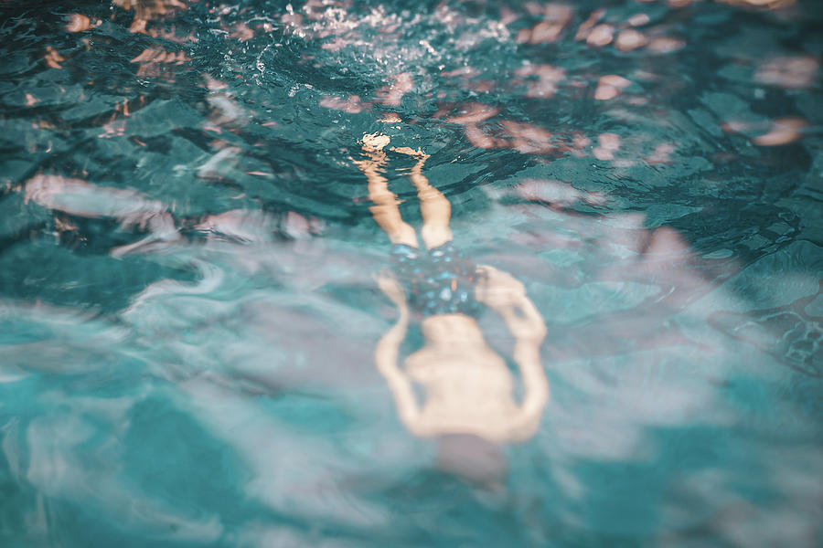 8 Years Old Faceless Boy Swimming In A Pool Photograph by Cavan Images