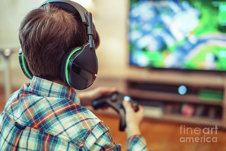 Young Boy Playing Video Game #8 Photograph by Sakkmesterke/science Photo Library