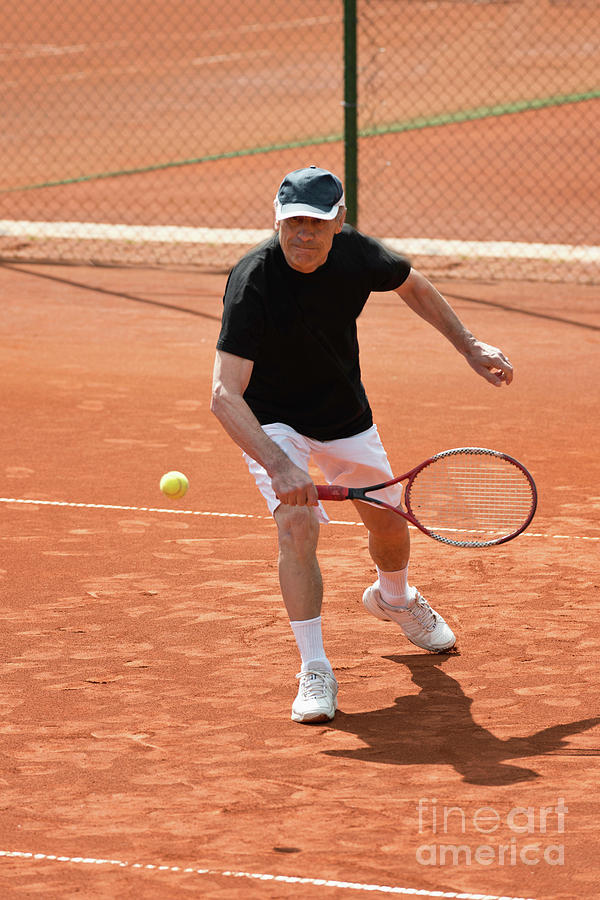 Active Senior Man Playing Tennis #9 Photograph by Microgen Images/science Photo Library