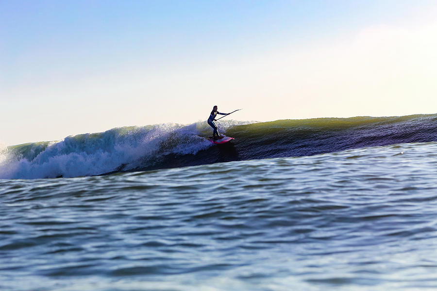 Female Sup Surfer At Sunset Time Photograph by Cavan Images