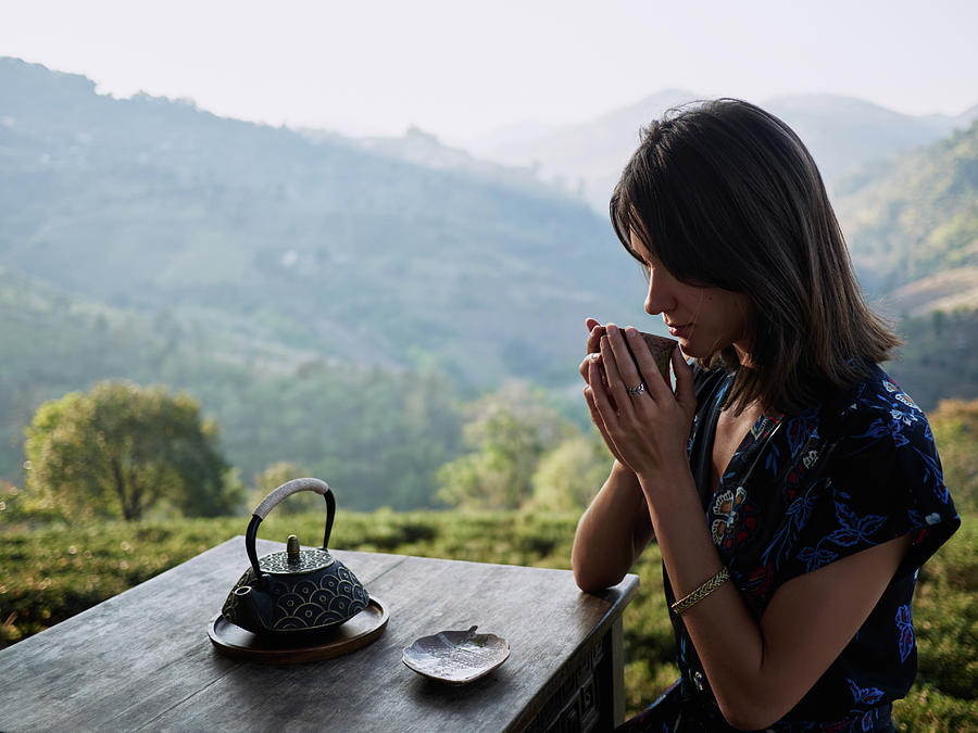 Woman Drinking Tea In Garden Photograph by Cavan Images | Fine Art America