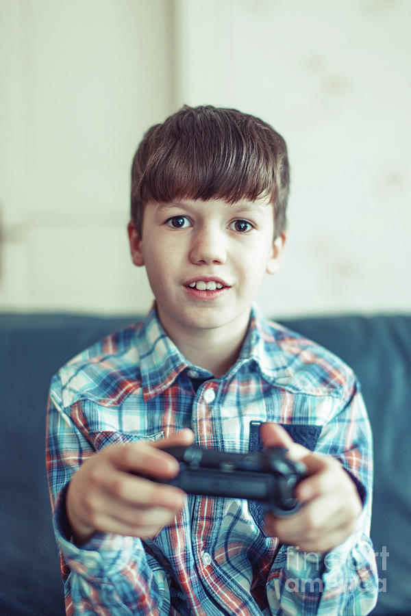 Young Boy Playing Video Game #9 Photograph by Sakkmesterke/science Photo Library
