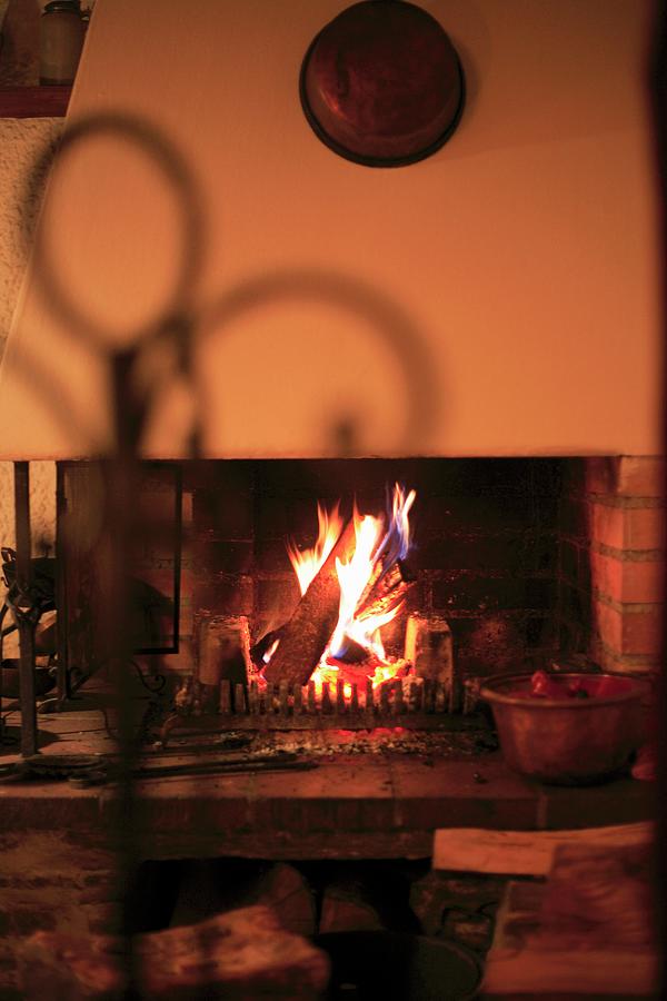 A Atmospheric Fire In An Old Brick Fireplace Photograph by Heidi Frhlich