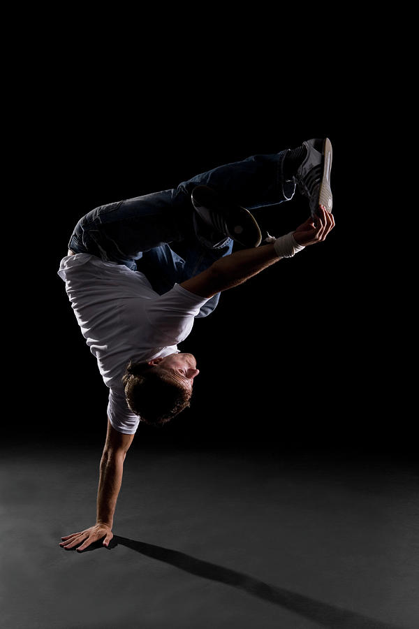 A B-boy Doing A  Freeze Breakdance Move Photograph by Halfdark