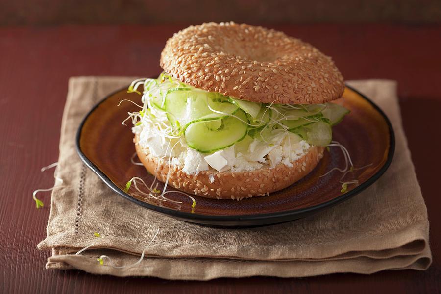 A Bagel Filled With Cucumber, Feta Cheese And Alfalfa Sprouts Photograph by Olga Miltsova