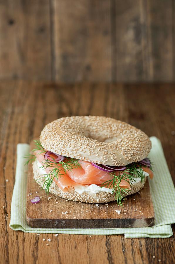 A Bagel With Cream Cheese, Salmon, Dill And Red Onions Photograph by Fotografie-lucie-eisenmann