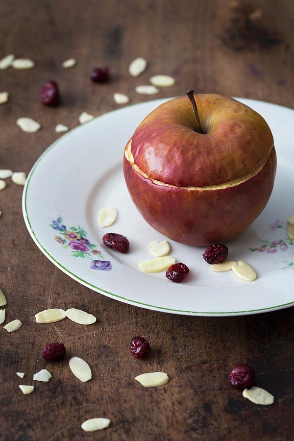 A Baked Apple Filled With Almonds And Dried Cranberries Photograph by Malgorzata Laniak