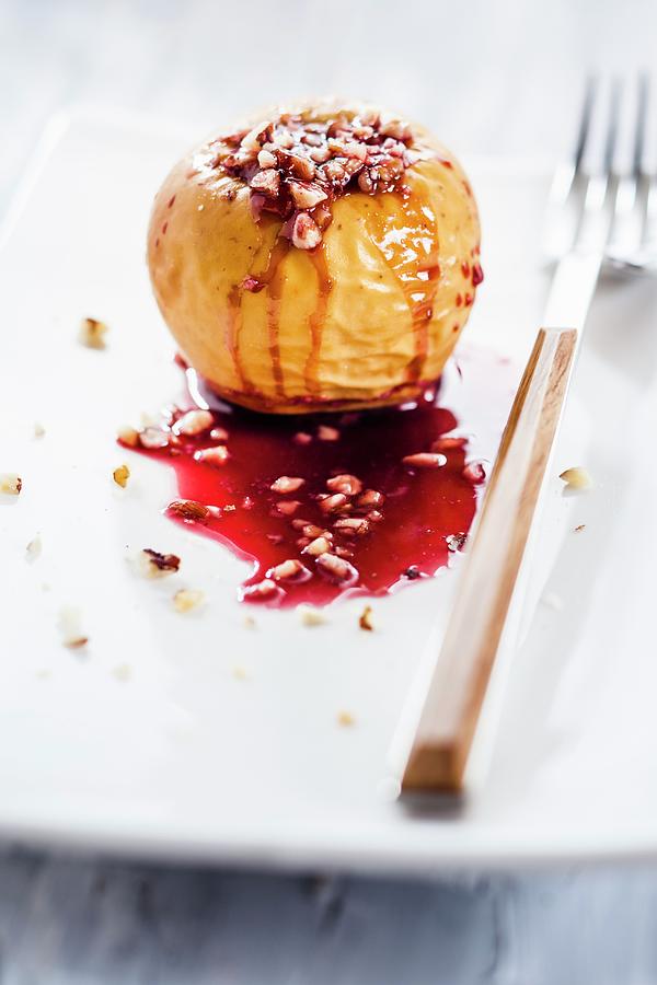 A Baked Apple Filled With Nuts And Redcurrant Jelly Photograph by Susan Brooks-dammann