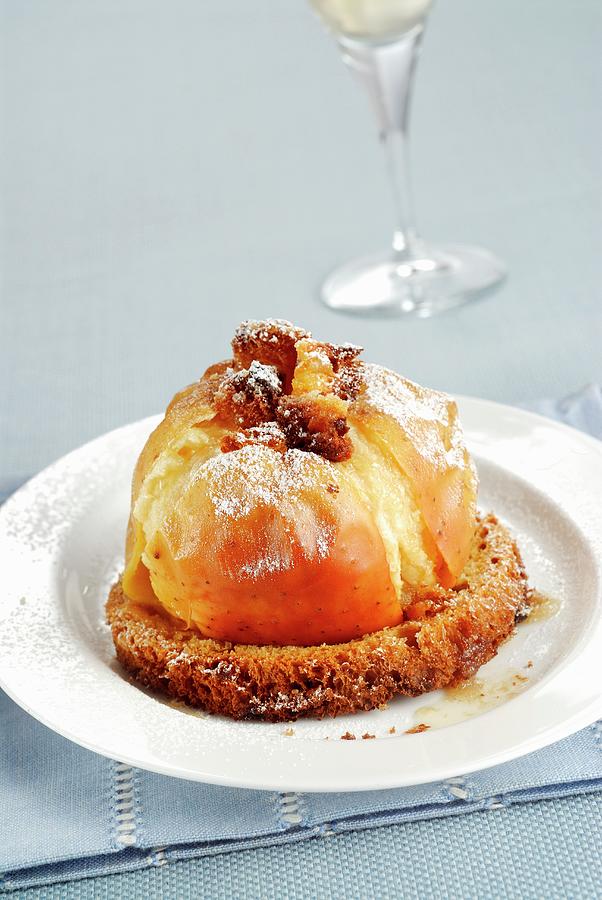 A Baked Apple Served On A Slice Of Panettone Photograph by Franco Pizzochero