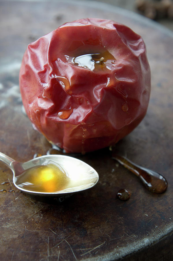 A Baked Apple With Honey Photograph by Martina Schindler