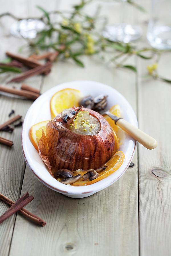 A Baked Onion With Mushrooms And Oranges Photograph by Martina Schindler