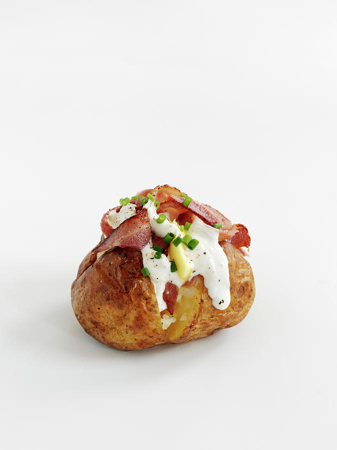 A Baked Potato With Bacon And Sour Cream Photograph by Gareth Morgans