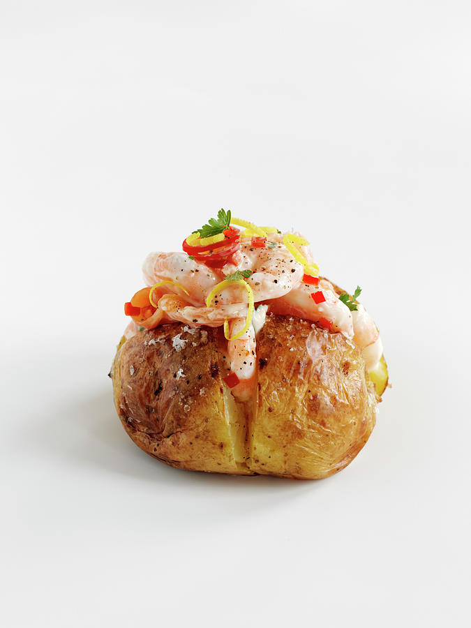 A Baked Potato With Prawns, Salmon And Chilies Photograph by Gareth Morgans
