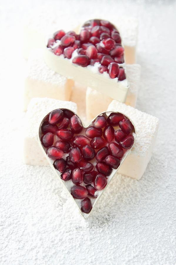 A Baking Dish Filled With White Chocolate And Pomegranate Seeds Photograph by Martina Schindler