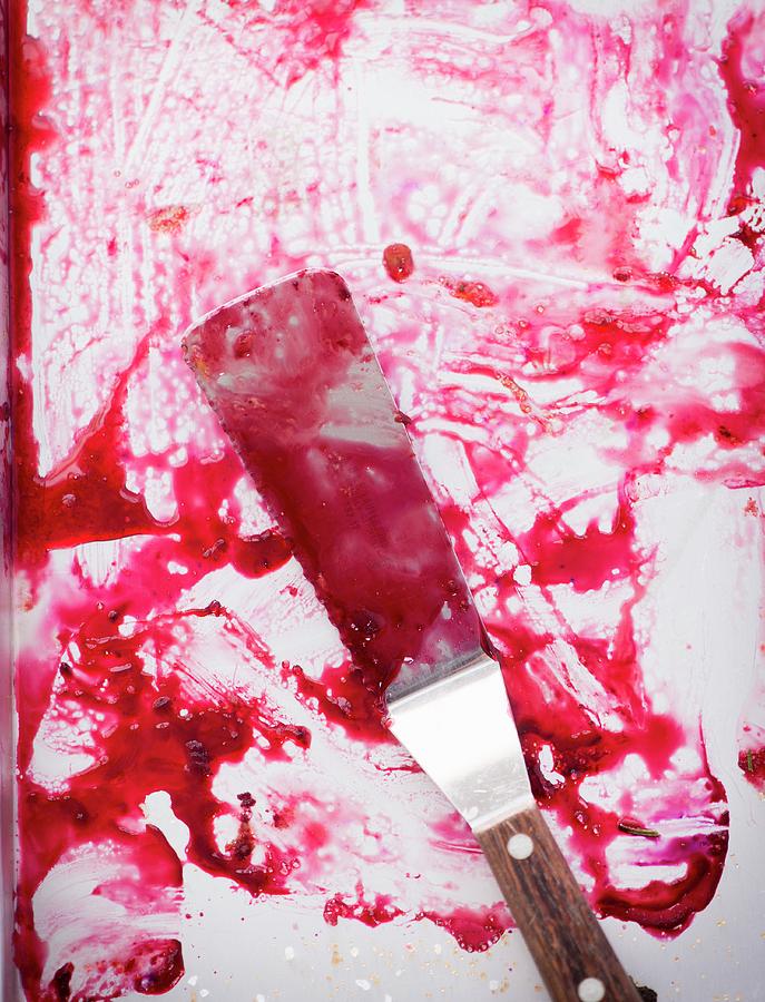 A Baking Tray And A Palette Knife Smeared With Plum Juice Photograph by Manuela Rther