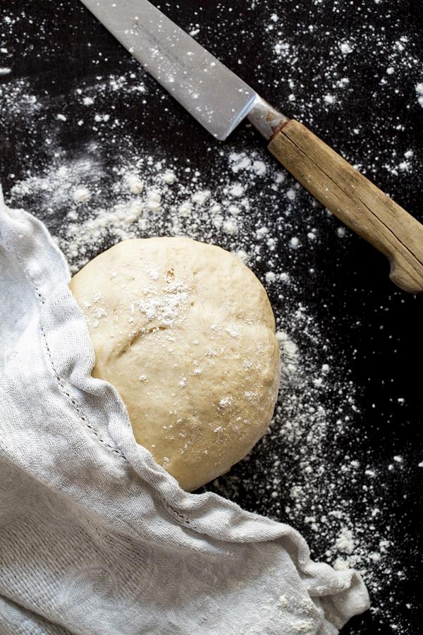A Ball Of Pizza Dough With Flour, A Cloth And A Knife Photograph by Sandra Krimshandl-tauscher