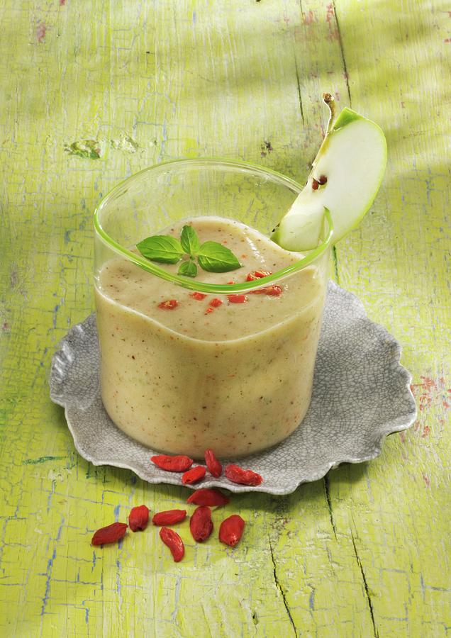 A Banana And Apple Smoothie With Yoghurt And Goji Berries Photograph by Karl Newedel