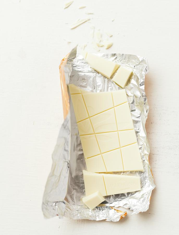 A Bar Of Broken White Chocolate Photograph by Manuela Rther