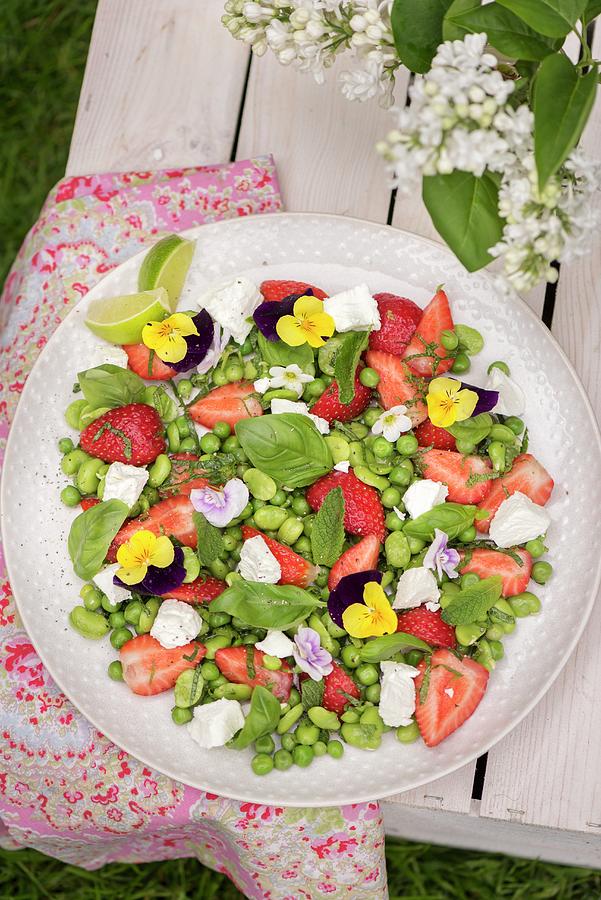 A Bean And Goats Cheese Salad With Strawberries And Edible Flowers Photograph by Winfried Heinze
