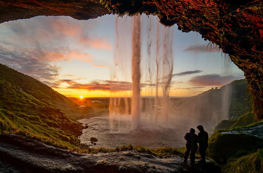 A beautiful sunset at Seljalandsfoss waterfall in Iceland Photograph by George Afostovremea