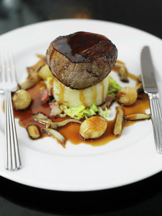 A Beef Medallion On A Bed Of Mashed Potatoes And Parsnips With Gravy ...