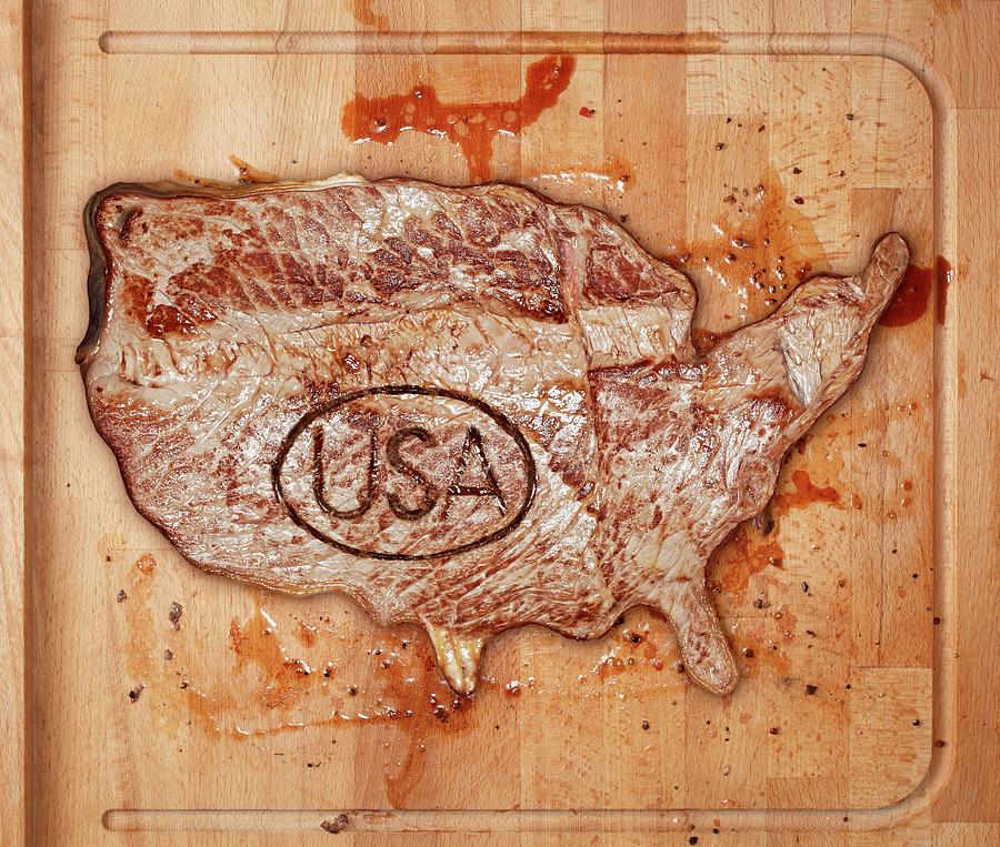 A Beef Steak With A Usa Stamp On A Chopping Board Photograph by Krger & Gross
