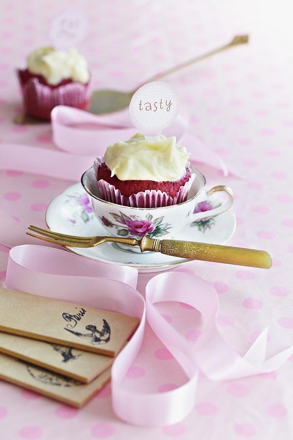 A Berry Cupcake With Frosting And A Label Served With A Cup Of Coffee Photograph by Tim Atkins Photography