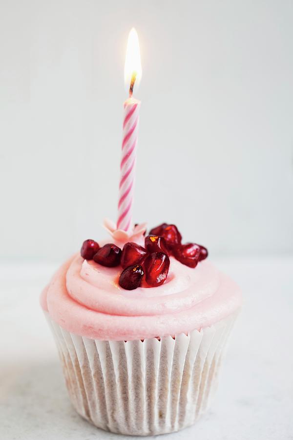 A Birthday Cupcake With Strawberry Cream And Pomegranate Seeds Photograph by Victoria Harley