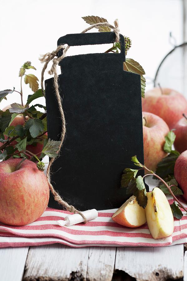 A Blackboard With Chalk And Fresh Apples Photograph by Schindler, Martina