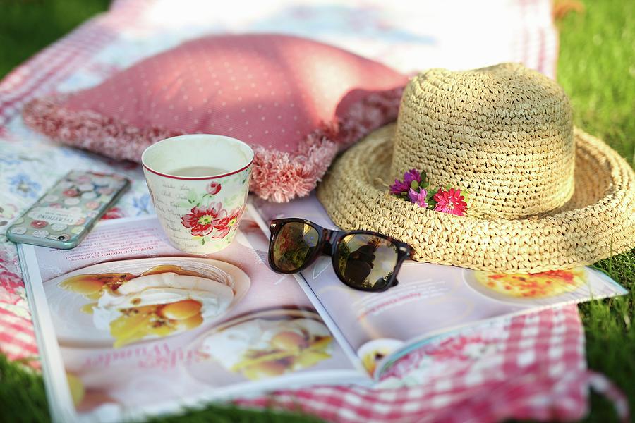A Blanket On The Grass, Coffe, Straw Hat And Journal Photograph by Dorota Ryniewicz