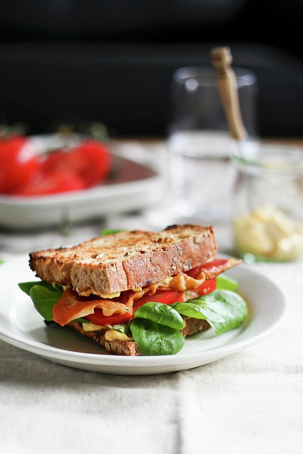 A Blt Sandwich With Bacon, Tomato And Spinach Photograph by Eva Lambooij