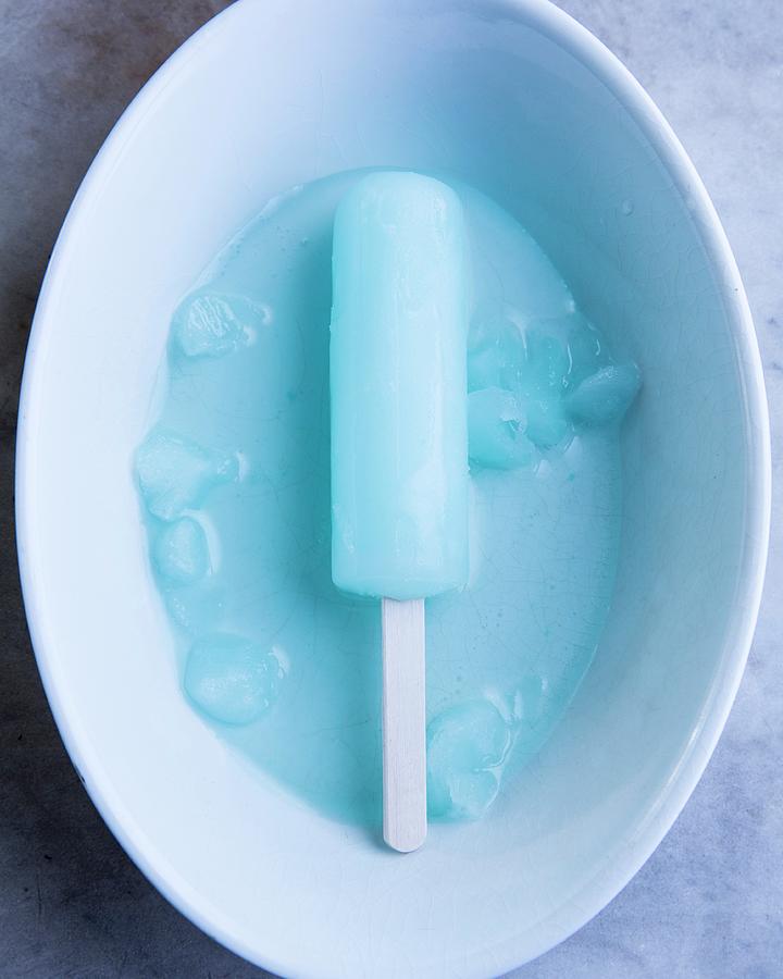 A Blue Ice Lolly In A White Bowl Photograph by Keller & Keller Photography