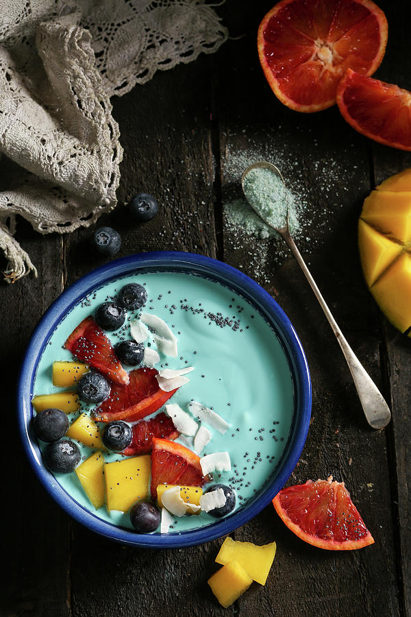 A Blue Majik Smoothie Bowl With Soy Yoghurt, Spirulina And Fruits Photograph by Stacy Grant