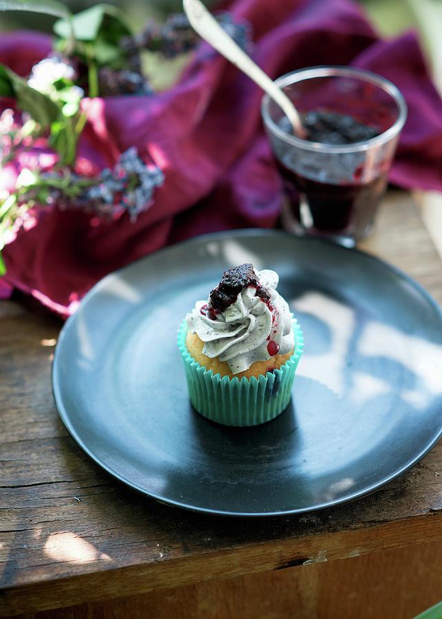 A Blueberry Buttercream Cupcake Photograph by Irina Meliukh
