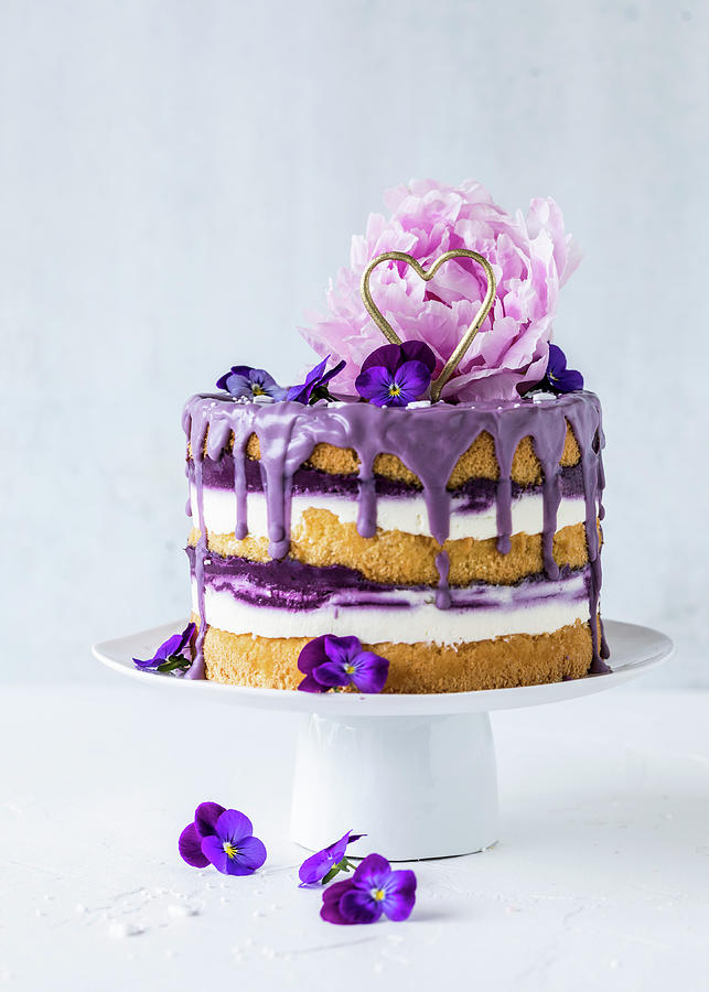 A Blueberry Drip Cake Decorated With A Peony Photograph by Emma Friedrichs