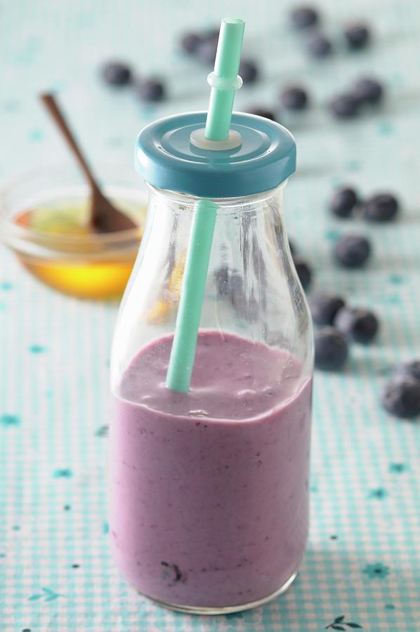 A Blueberry Smoothie In A Glass Bottle Photograph by Jean-christophe Riou