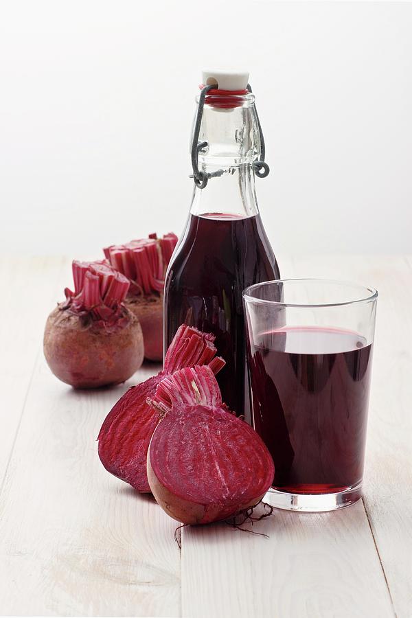 A Bottle And A Glass Of Beetroot Juice Photograph by Petr Gross