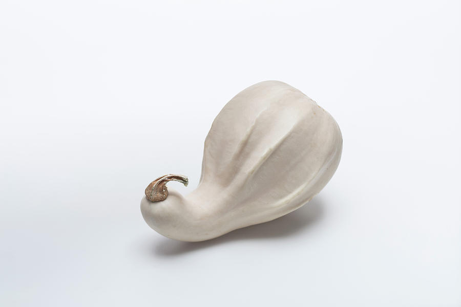 A Bottle Gourd On A White Surface Photograph by Eising Studio