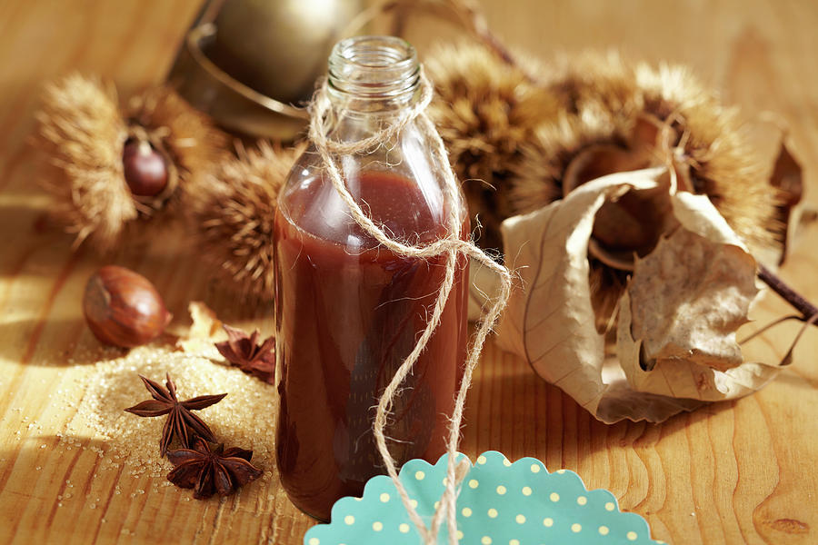 A Bottle Of Homemade Chestnut Liqueur With Cocoa And Vodka Photograph by Teubner Foodfoto