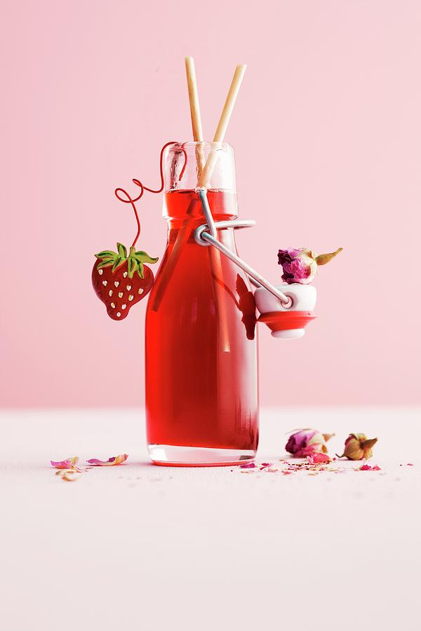 A Bottle Of Homemade Strawberry And Rose Syrup Photograph by Michael Wissing