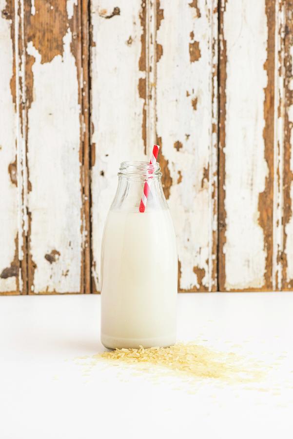 A Bottle Of Rice Milk With A Straw Photograph by Hein Van Tonder