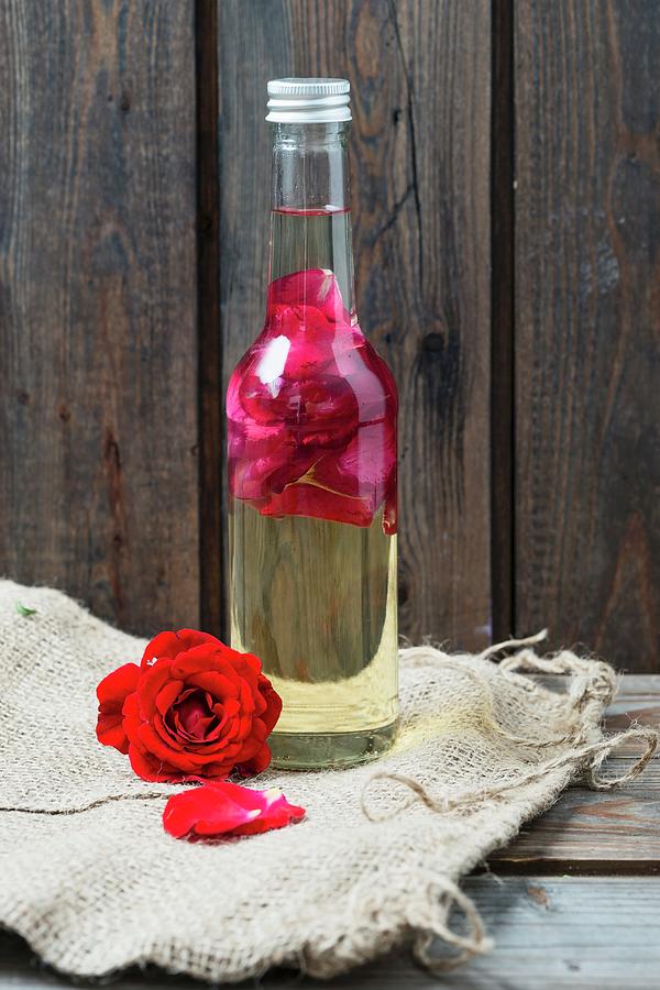 A Bottle Of Rose Petal Oil Photograph by Mandy Reschke