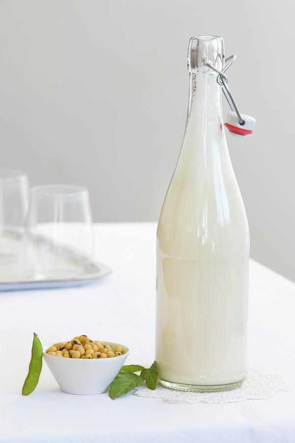 A Bottle Of Soya Milk And A Dish Of Soya Beans Photograph by Lydie Besancon