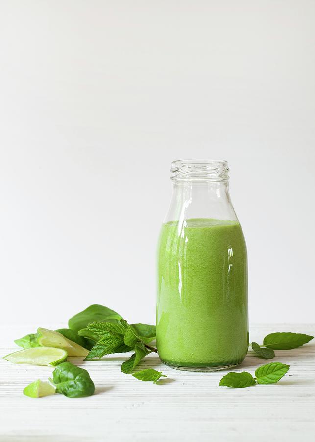 A Bottle Of Spinach, Mint And Lime Smoothie Photograph by Jane Saunders