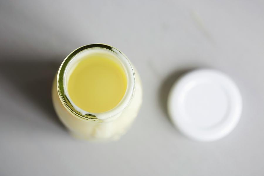 A Bottle Of Vanilla Sauce With A Lid Photograph by Esther Hildebrandt