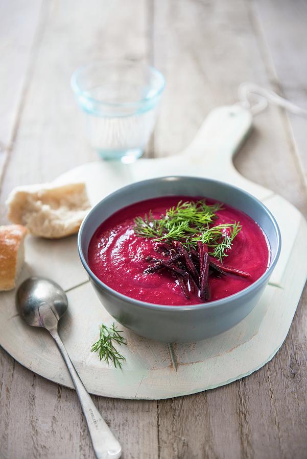 A Bowl Of Beetroot Soup With A Dill Garnish And Bread Photograph by Magdalena Hendey