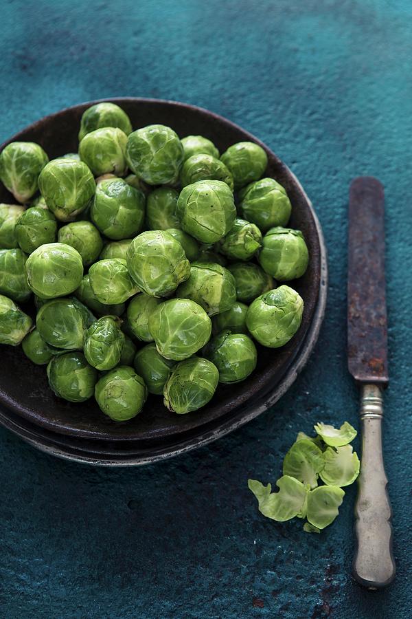 A Bowl Of Brussels Sprouts Photograph by Aniko Takacs