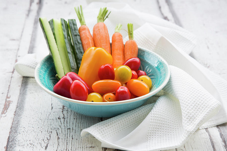 A Bowl Of Carrots, Pepper, Cucumber And Tomatoes Photograph by Larissa Veronesi